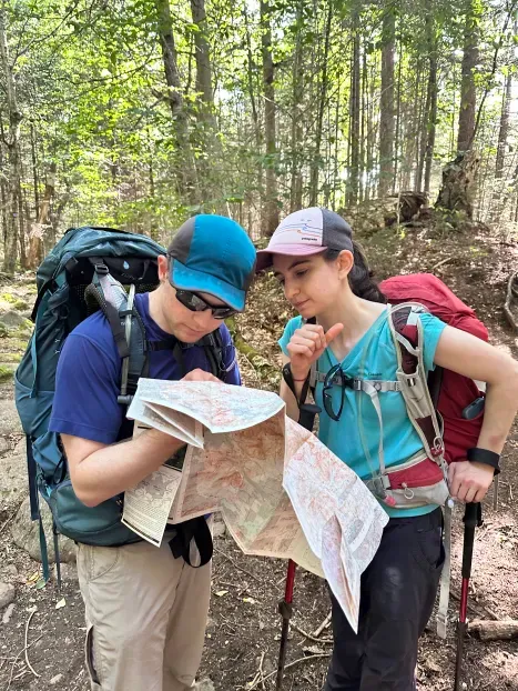 Gabby and Travis looking at the map