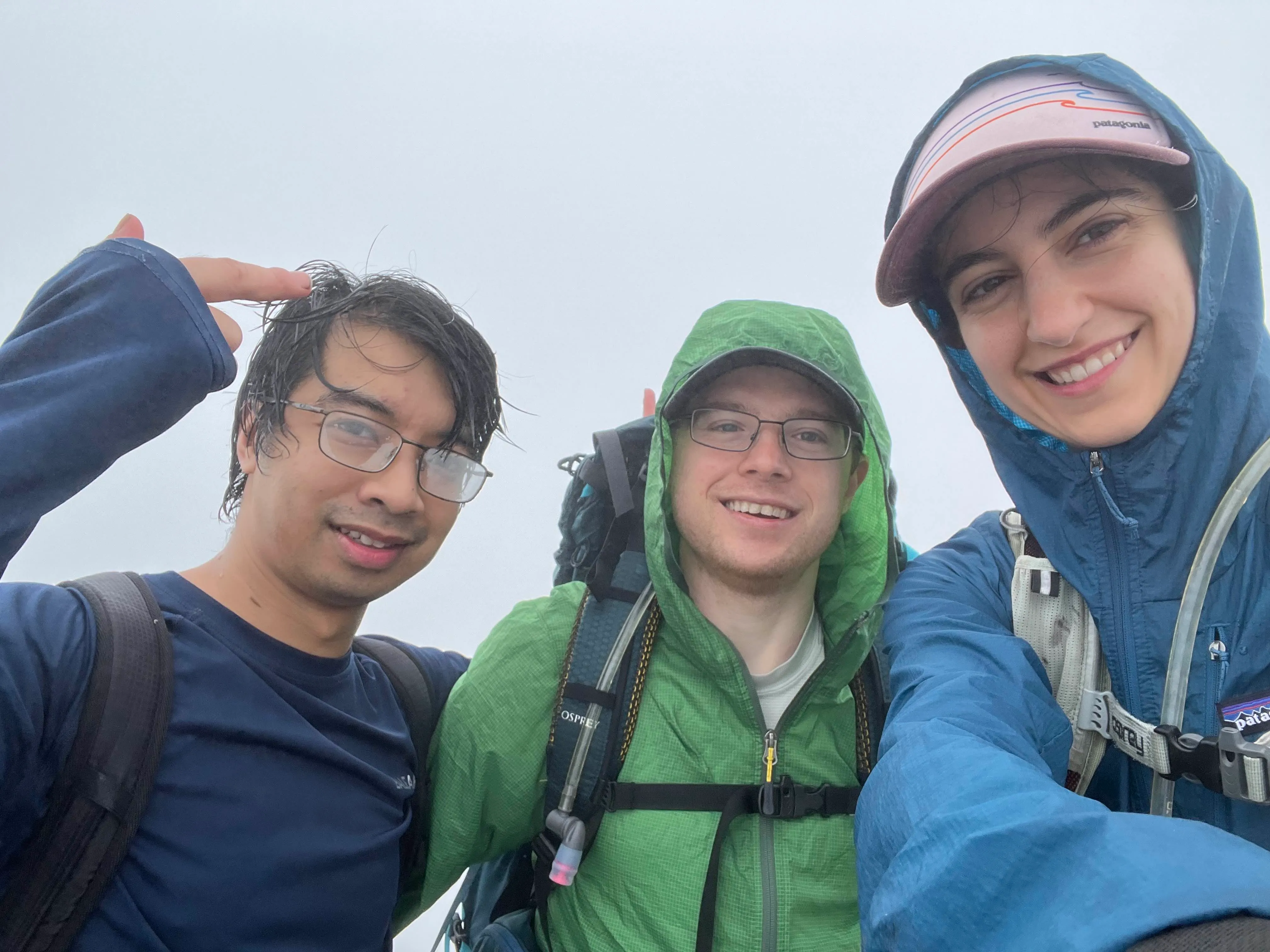 The three hikers at the summit